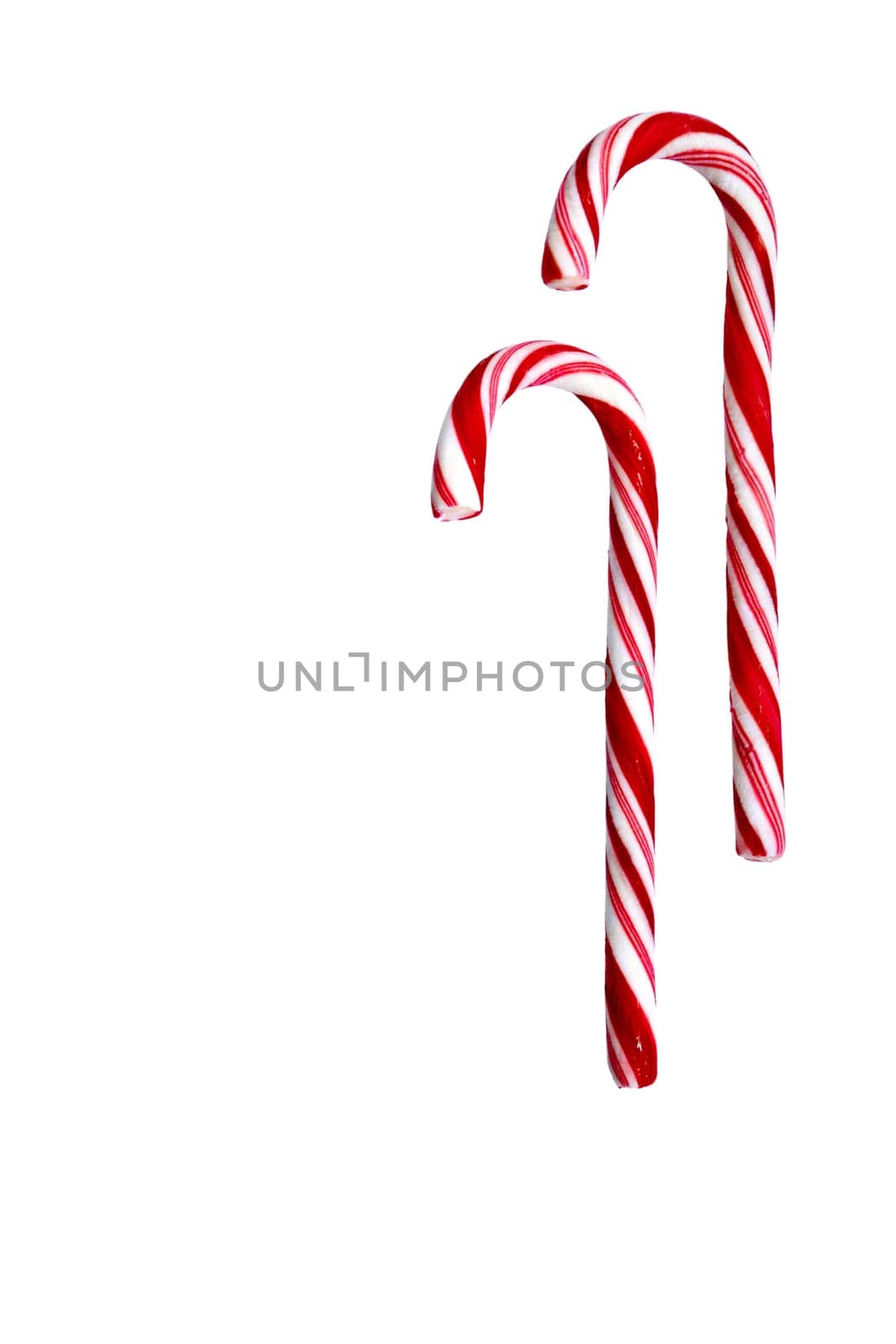 Two candy canes isolated on white background. Christmas, holiday concept. Space for copy. Useful as greeting card. Clipping path included.