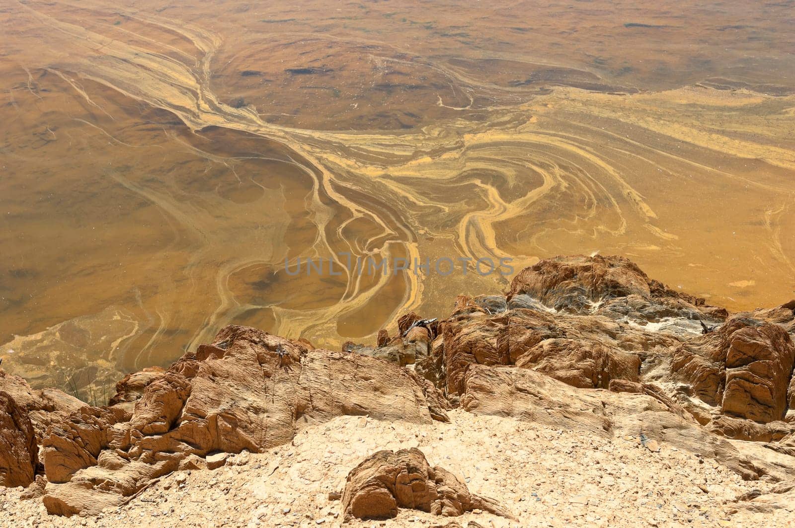 Detail of polluted riverbed of Mosteirao, downstream abandoned pyrite mine of S. Domingos , Mertola, Portugal