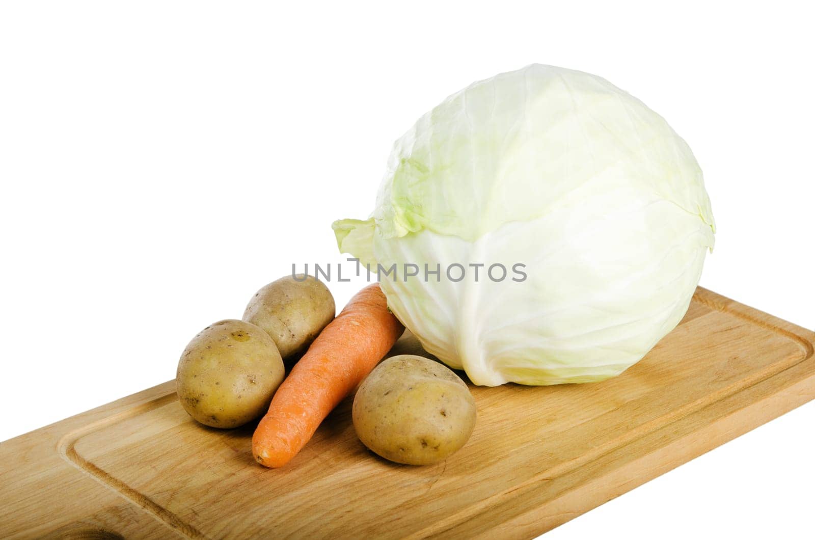 Fresh vegetables on a kitchen Board isolated on white