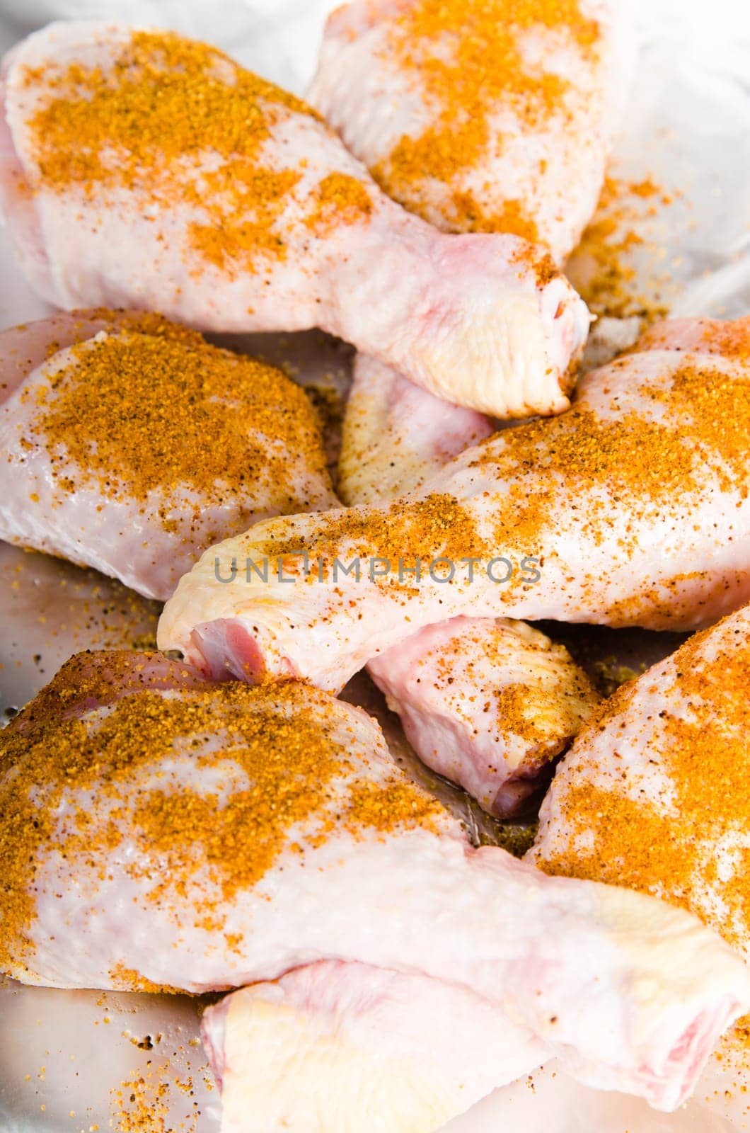 spiced chicken legs on the foil