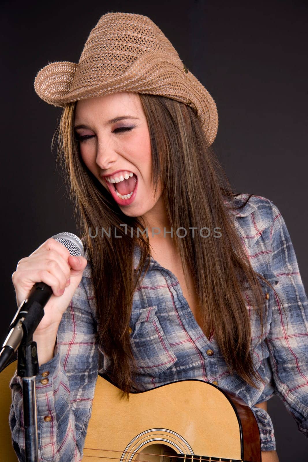 A western girl belts out a tune
