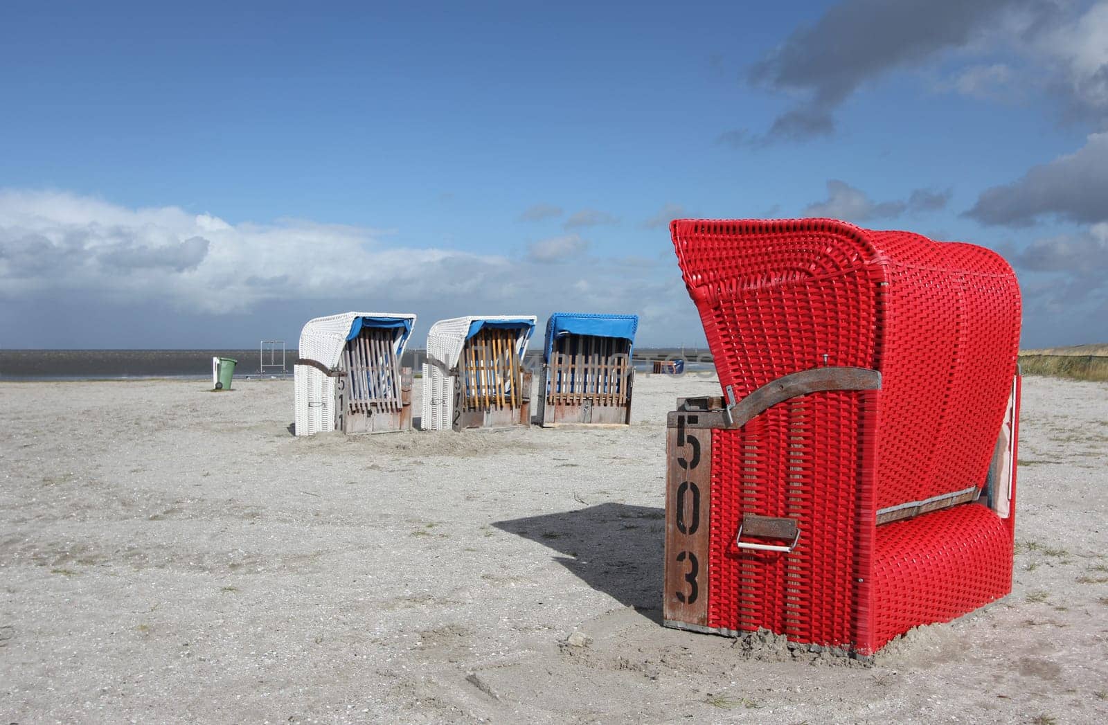 red beach chair on a beach at the North Sea
