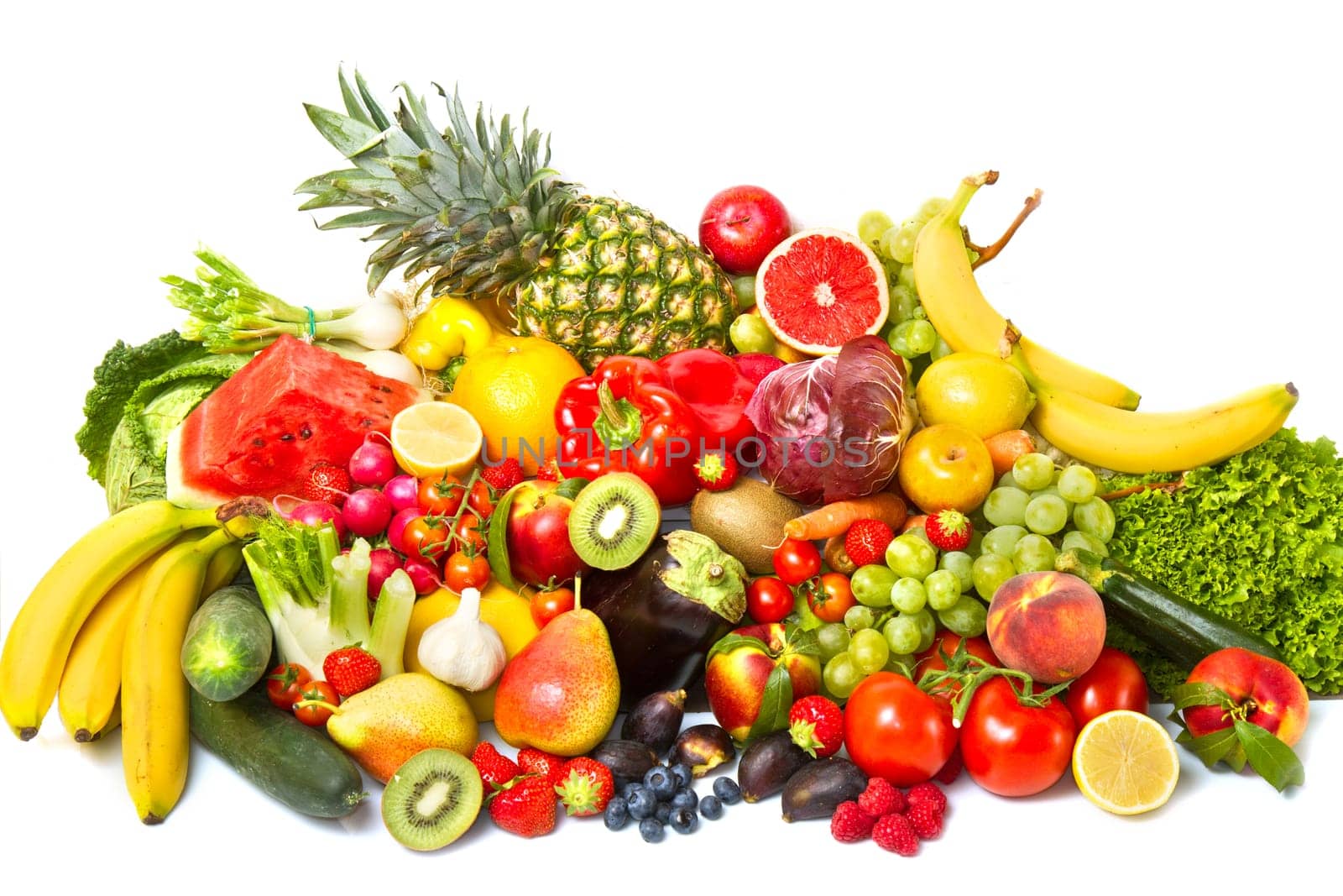 Fruits and vegetables like tomatoes, zucchini, melons, bananas and grapes arranged in a group, natural still life for healthy food