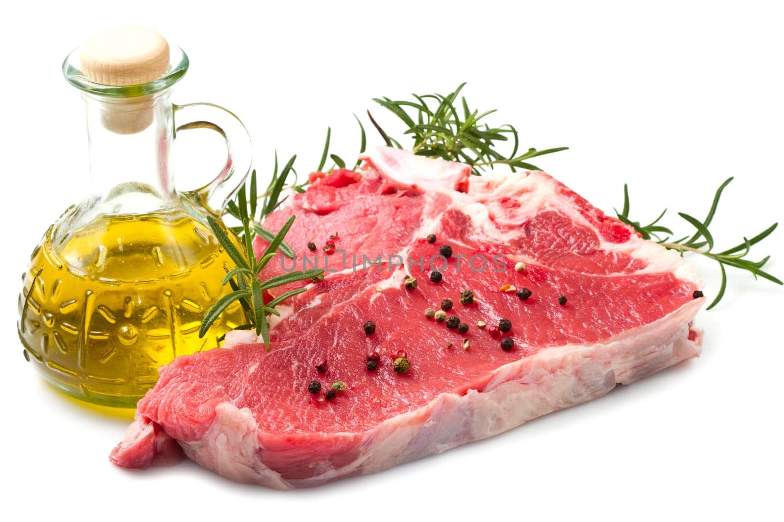 raw T-bone with rosemary on white background