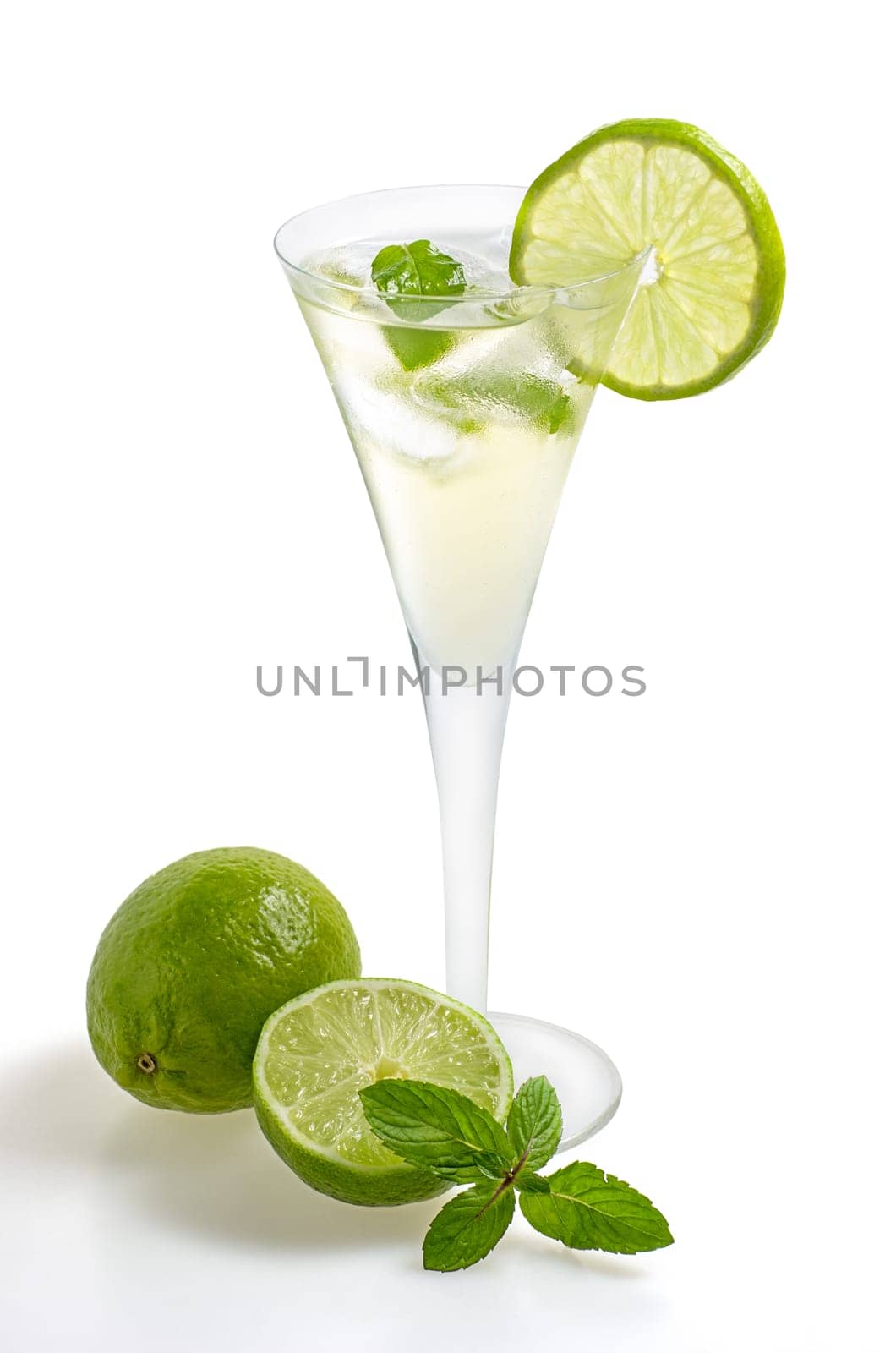 Aperitif with limes and mint in a champagne flute