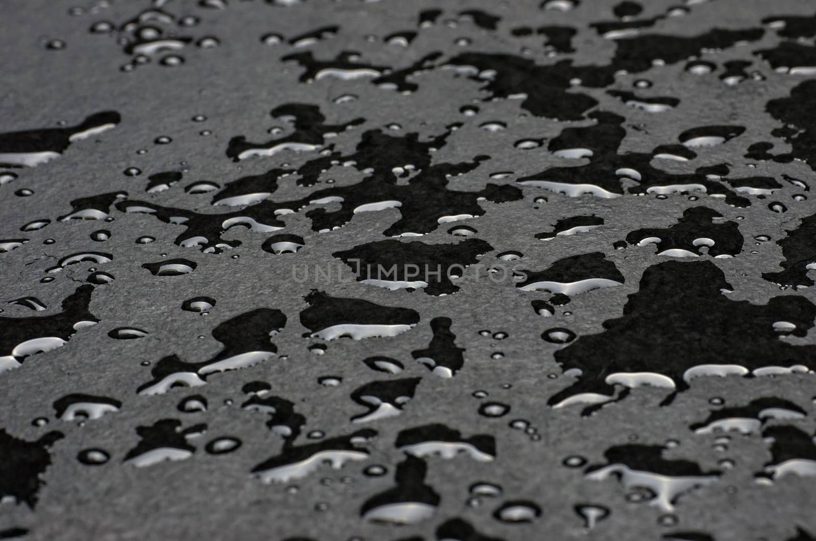 Macro shot of a slate slab with water droplets