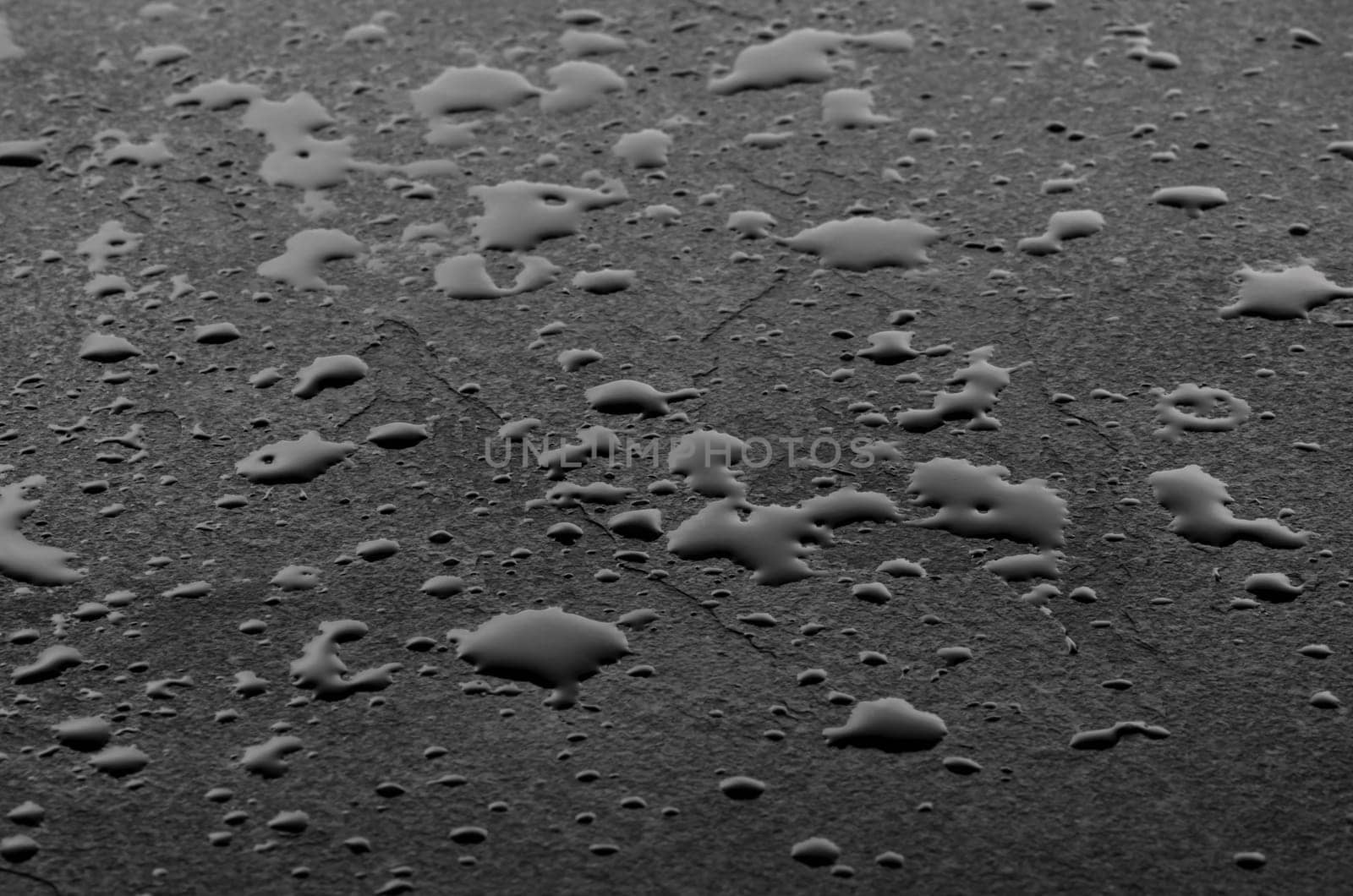 Macro shot of a slate slab with water droplets
