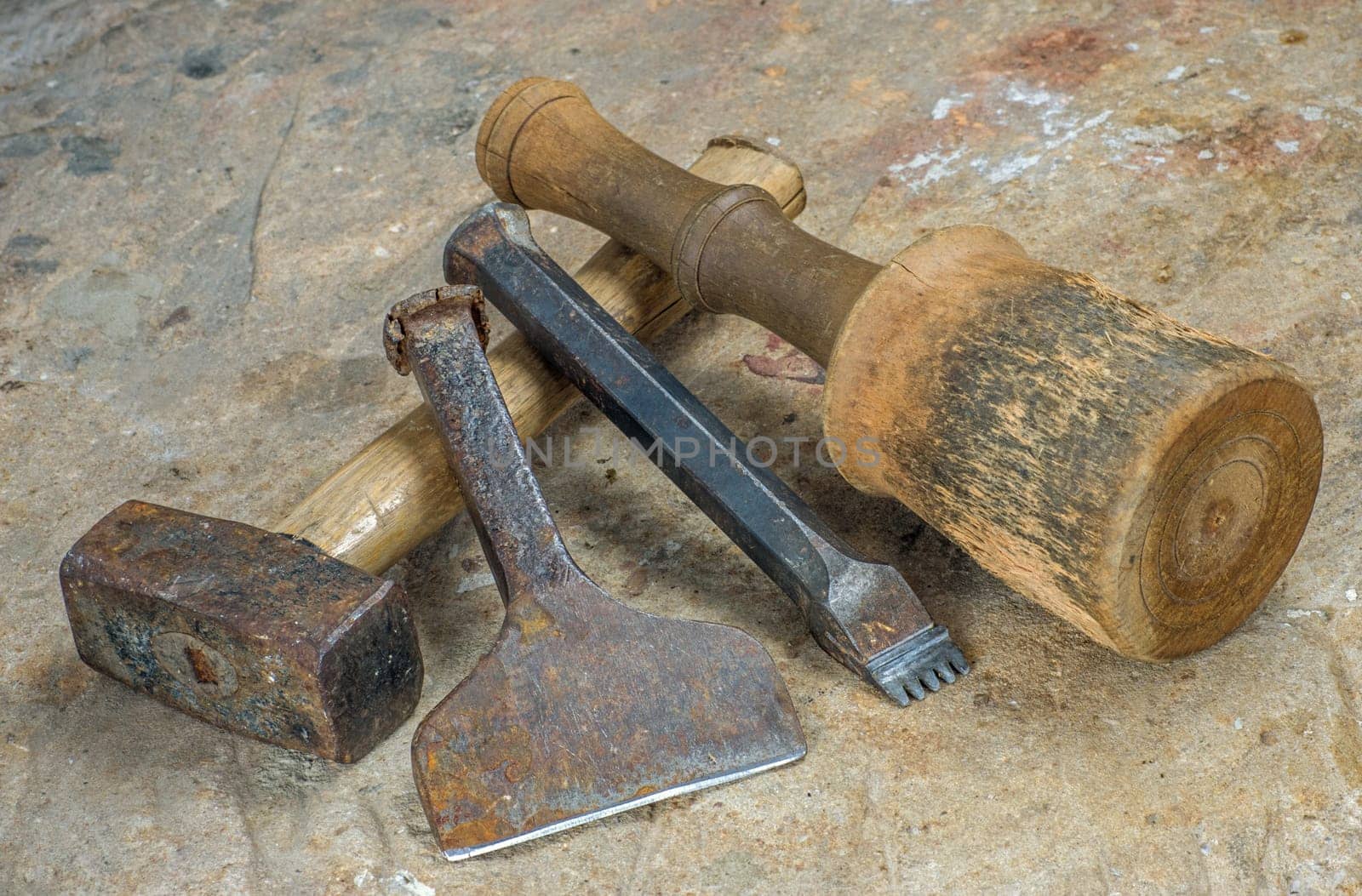 Stonemason's tool on a sandstone slab