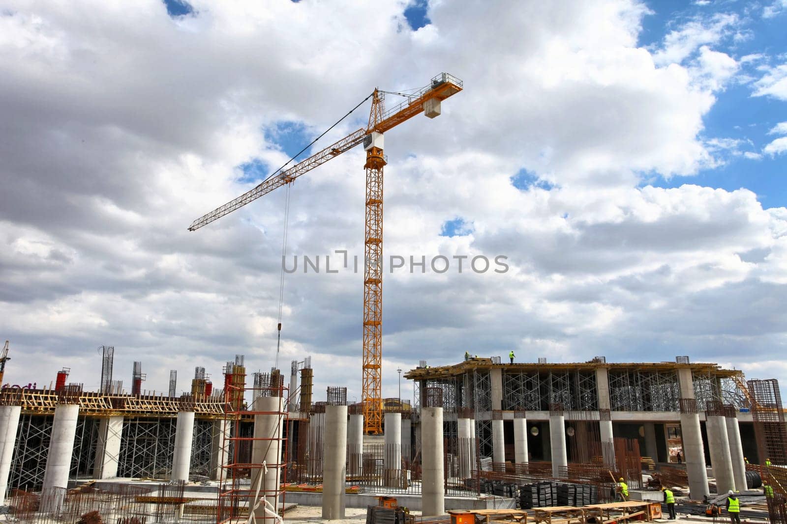 Construction workers working on scaffolding