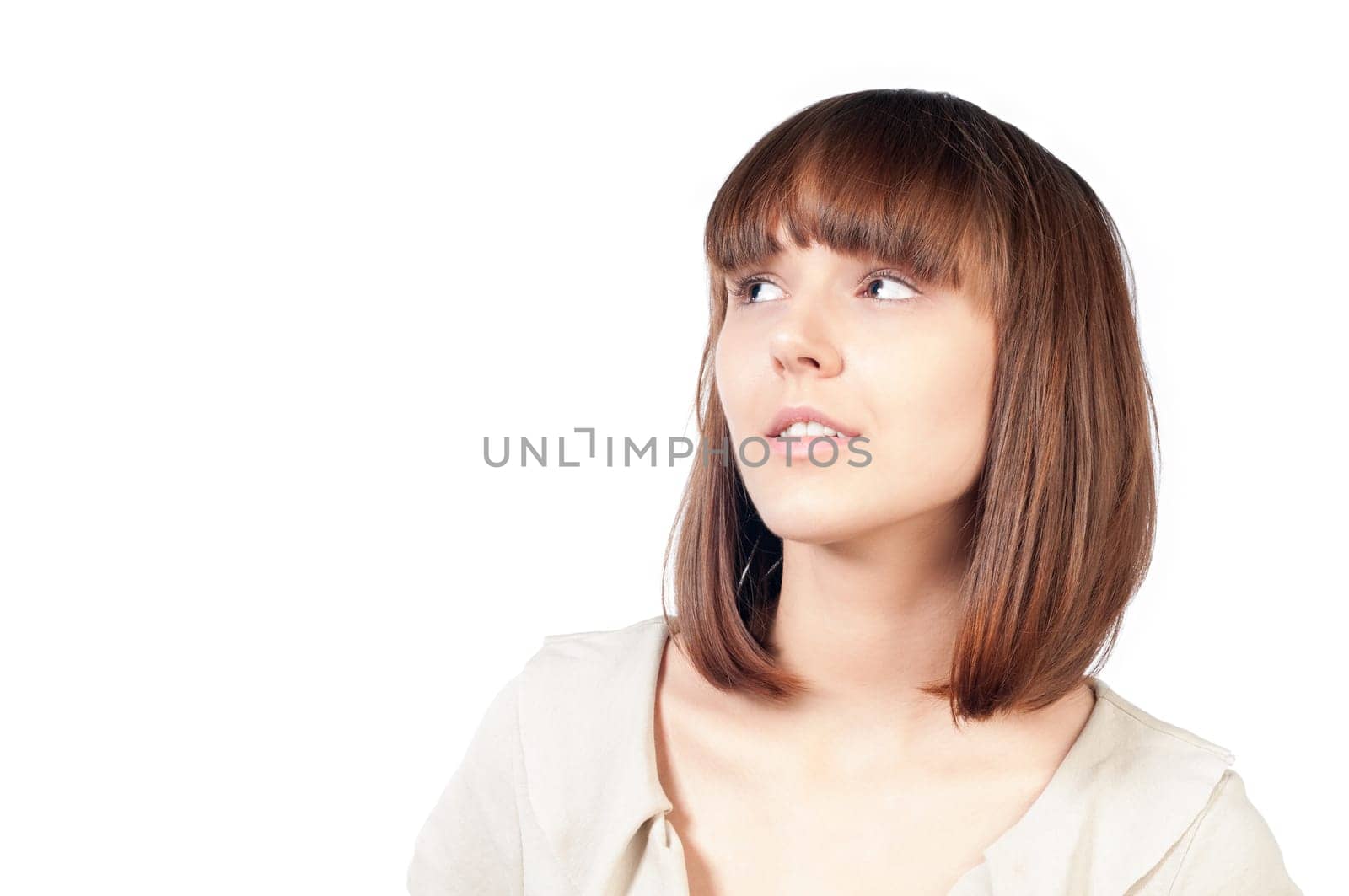 beautiful and happy young woman thinking. A lot of copy space. Isolated on white background.
