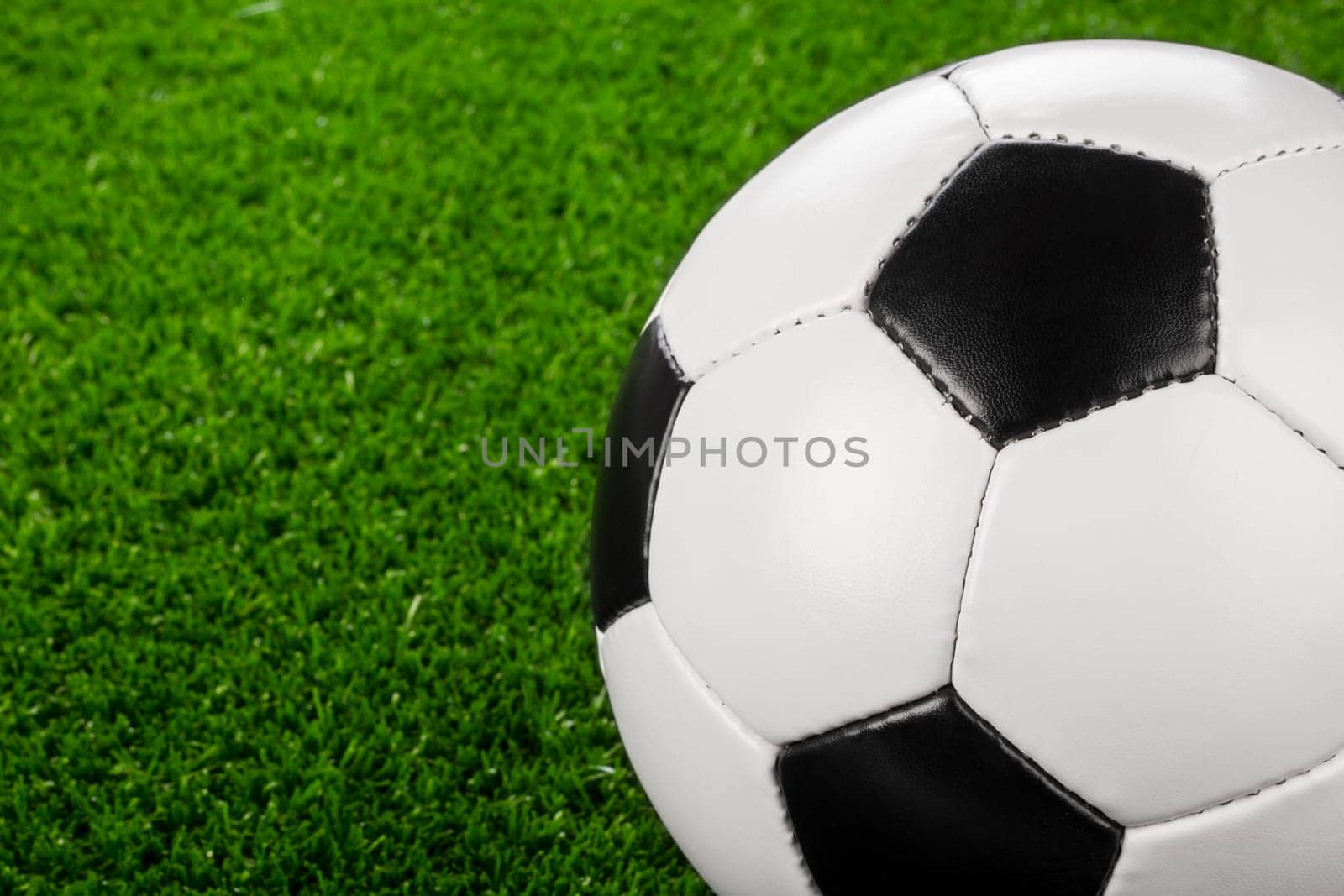 a soccerball on a green meadow