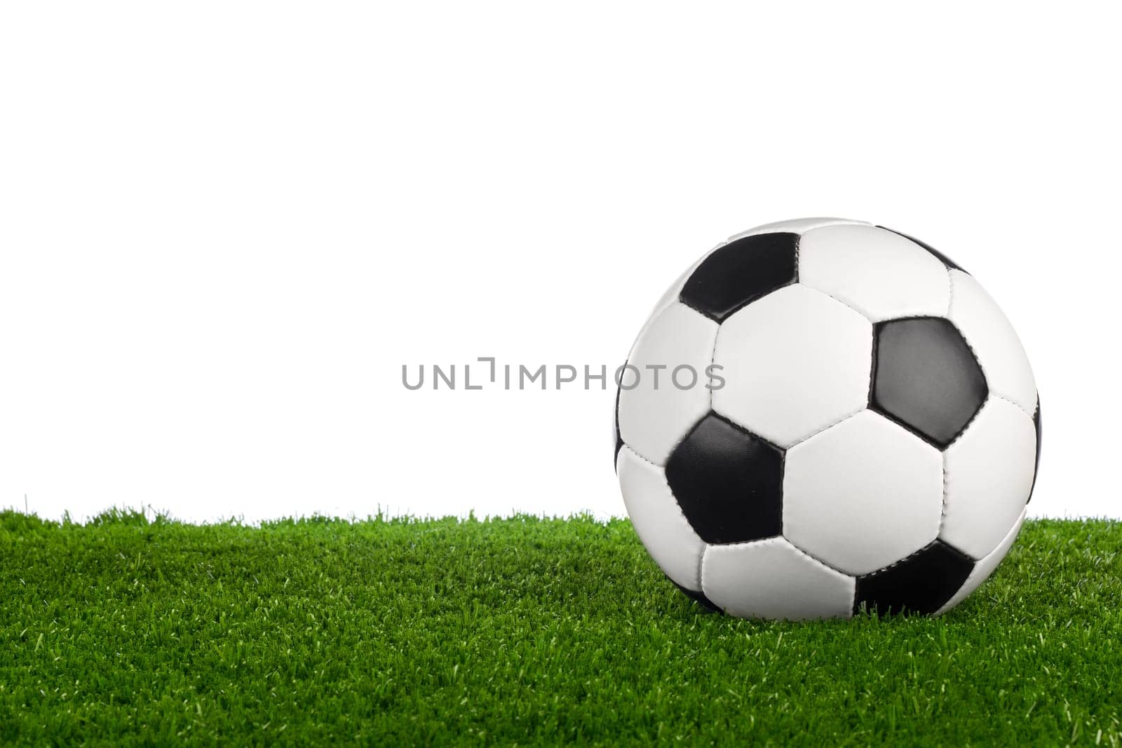 a soccerball on a green meadow