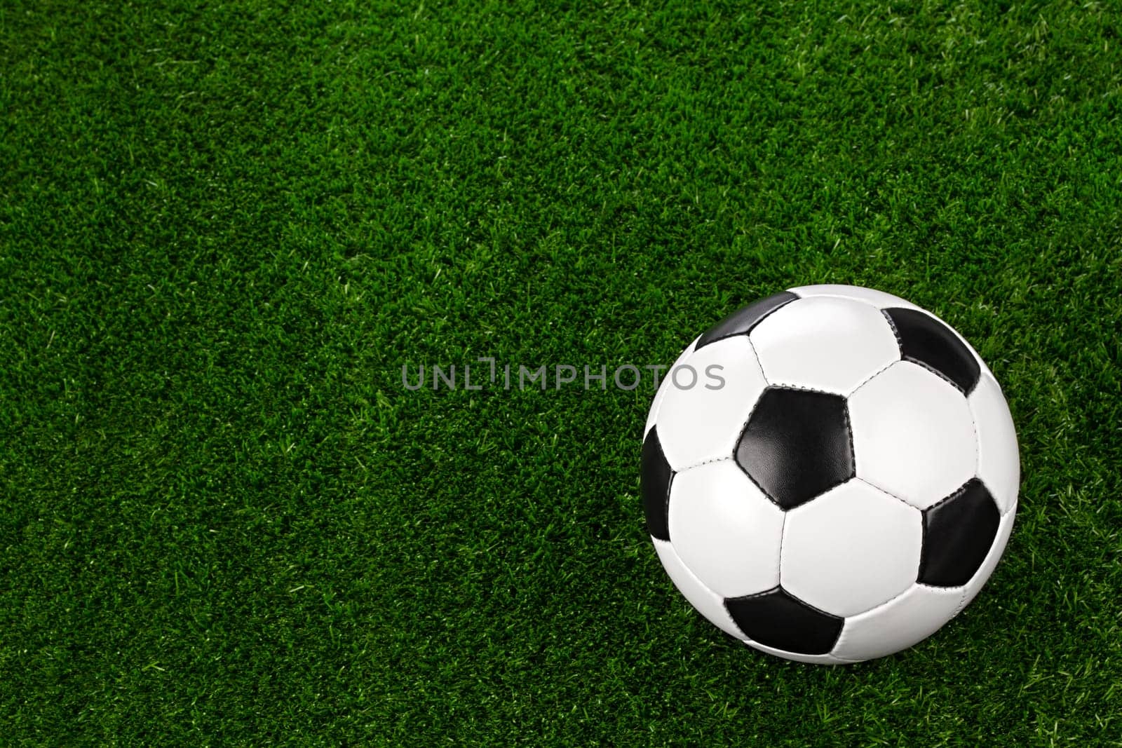 a soccerball on a green meadow