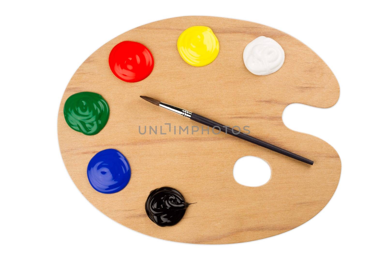 Wooden color palette with paint and brush.