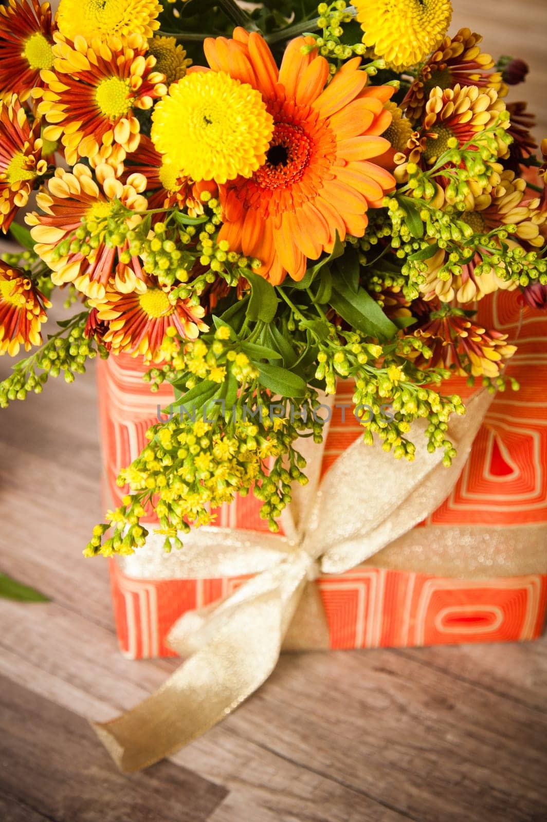 box with a gift and a bouquet of flowers
