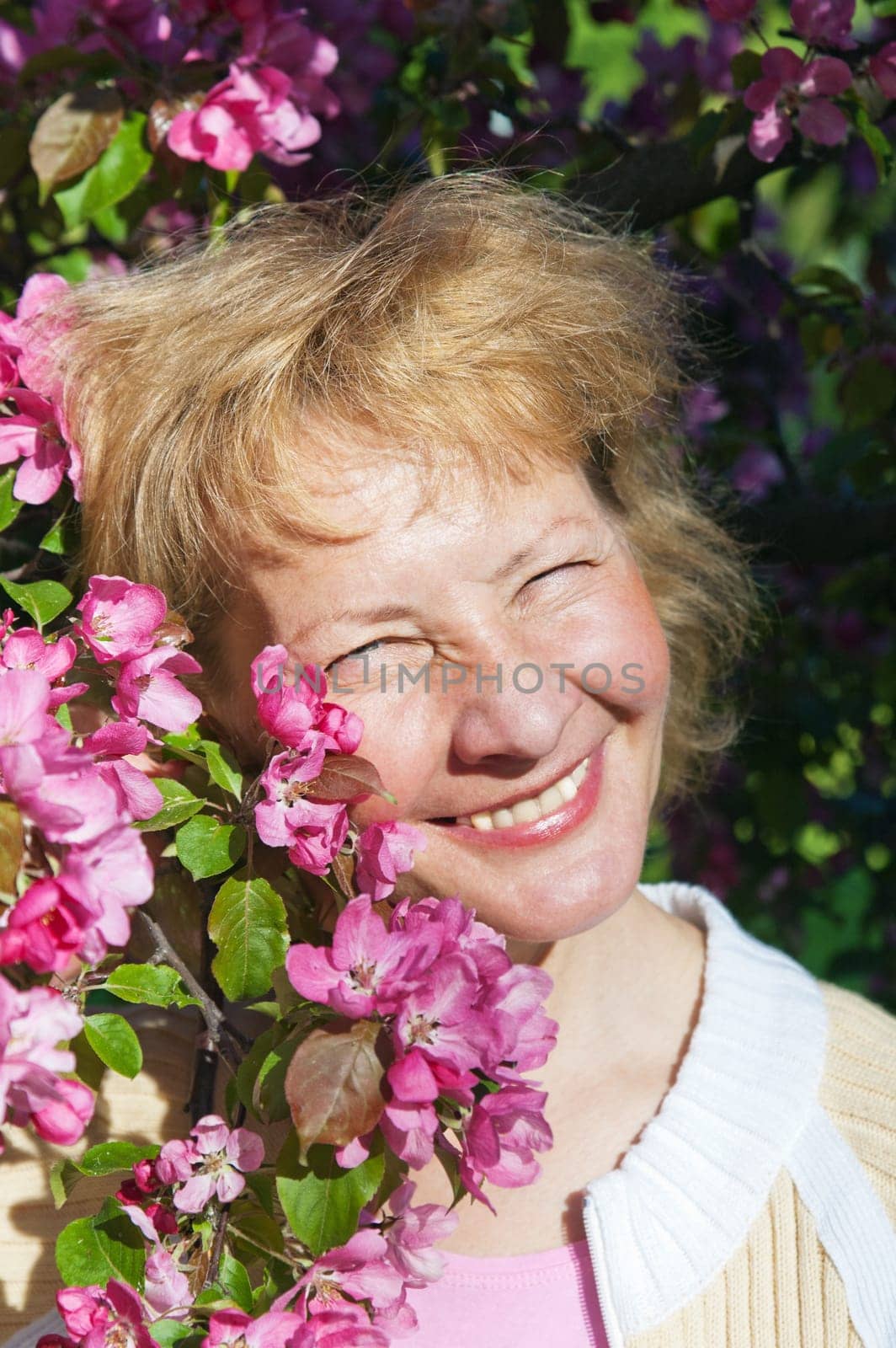 a middle-aged woman in a blossoming magnolias