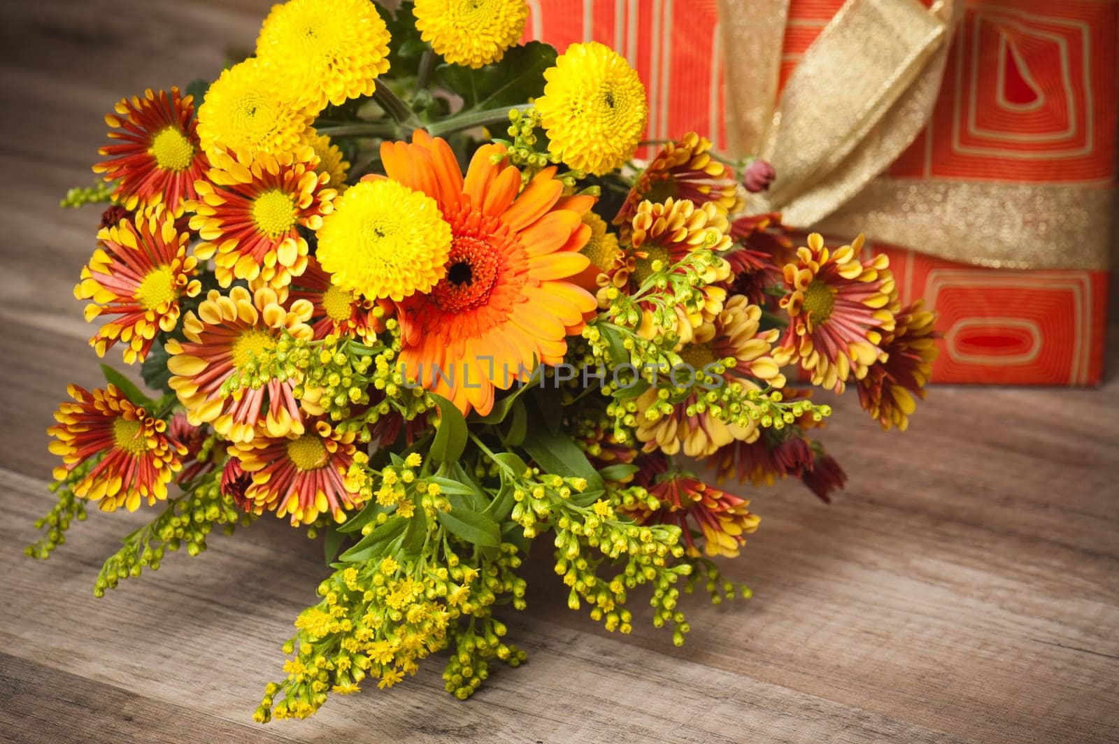 box with a gift and a bouquet of flowers