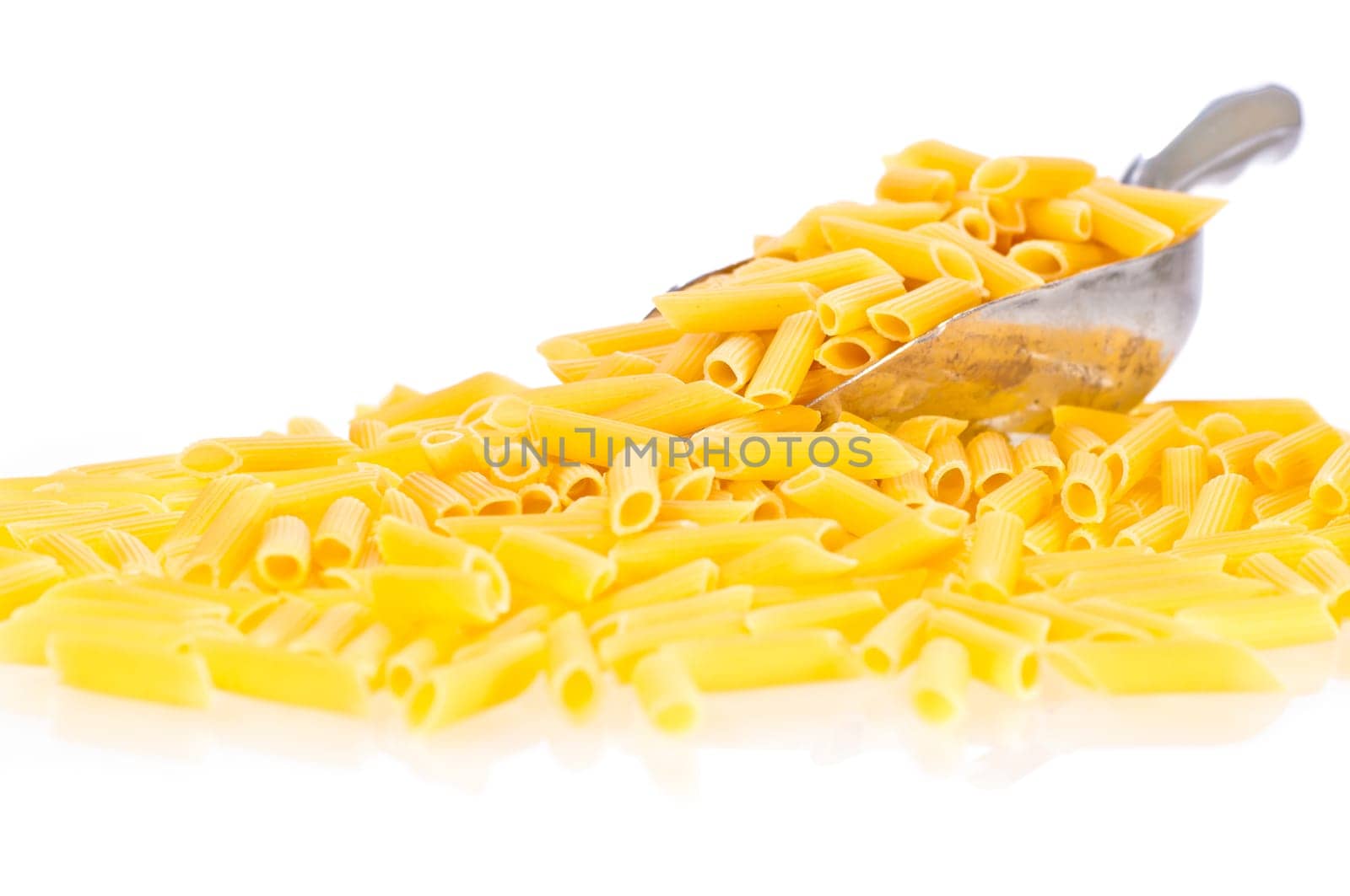 Penne pasta flowing from a scoop