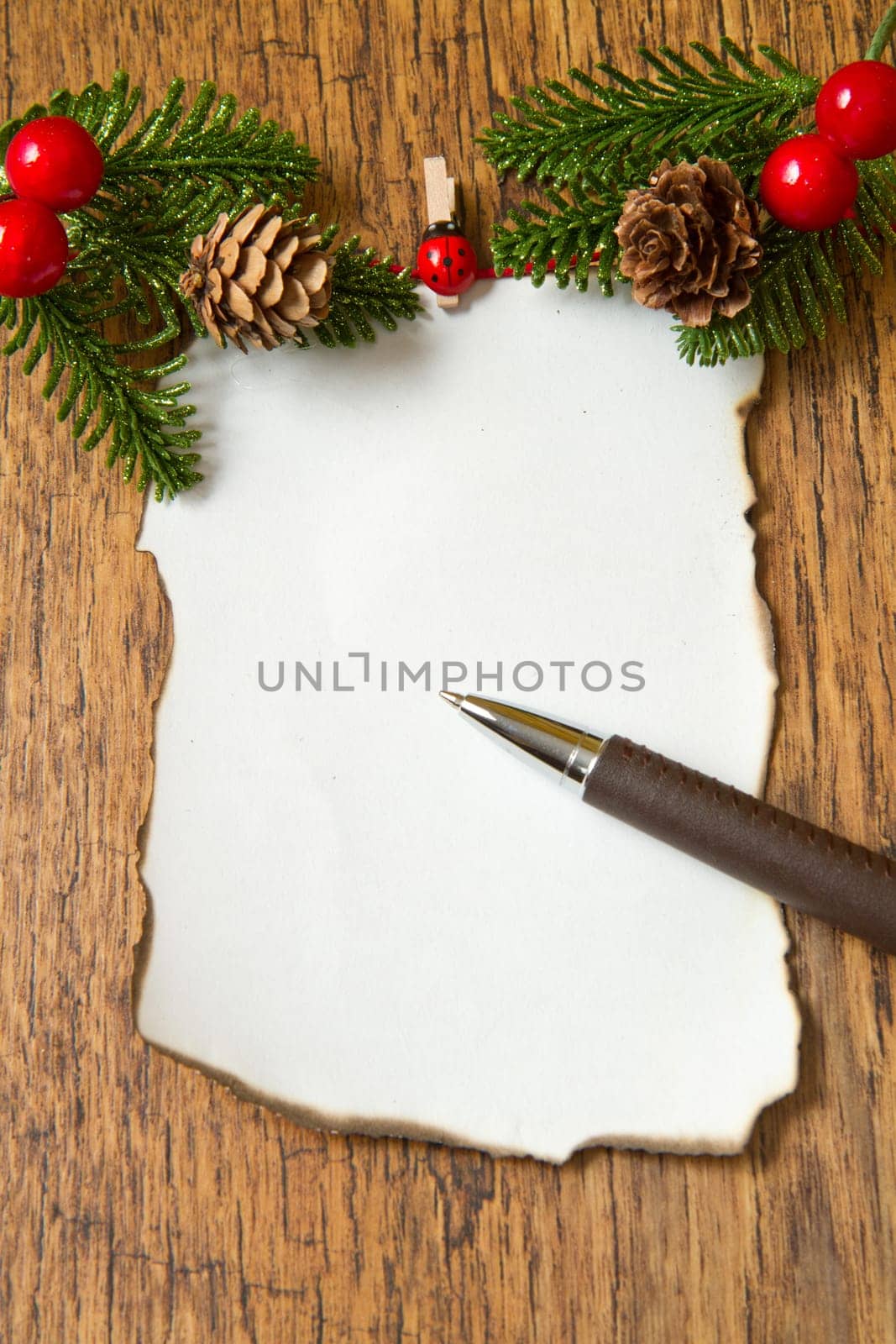 blank note with christmas decoration on wooden background