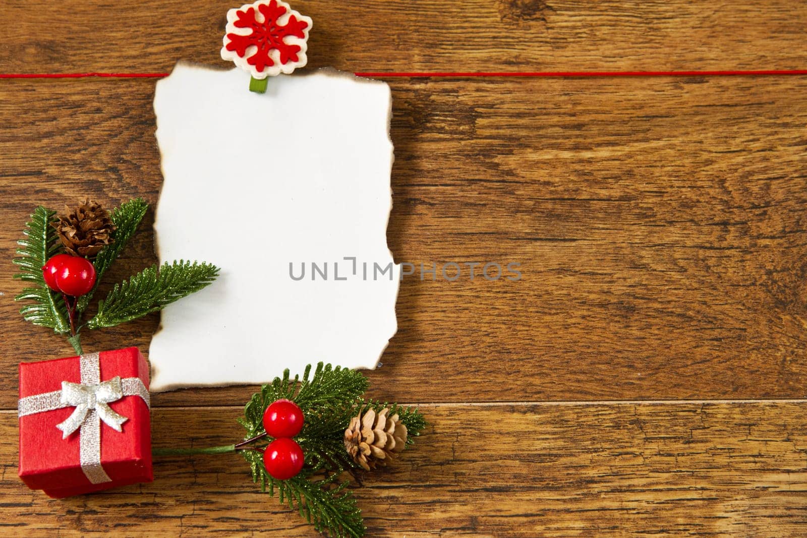 blank note with christmas decoration on wooden background