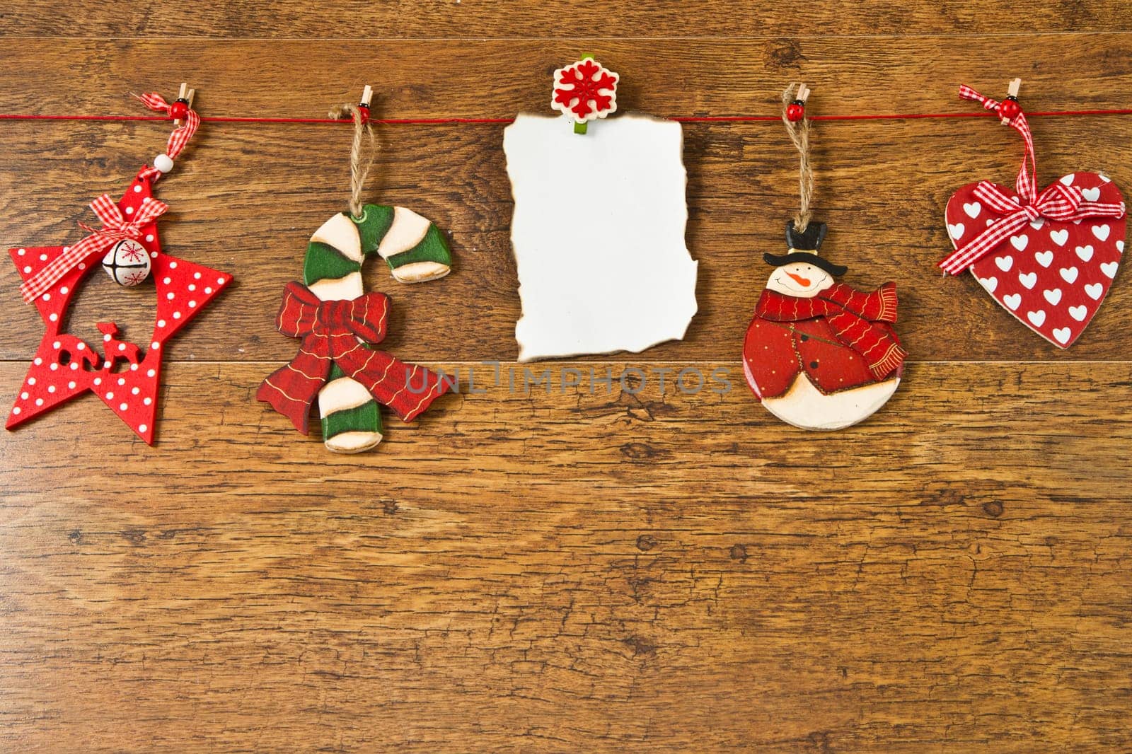 blank note with christmas decoration on wooden background