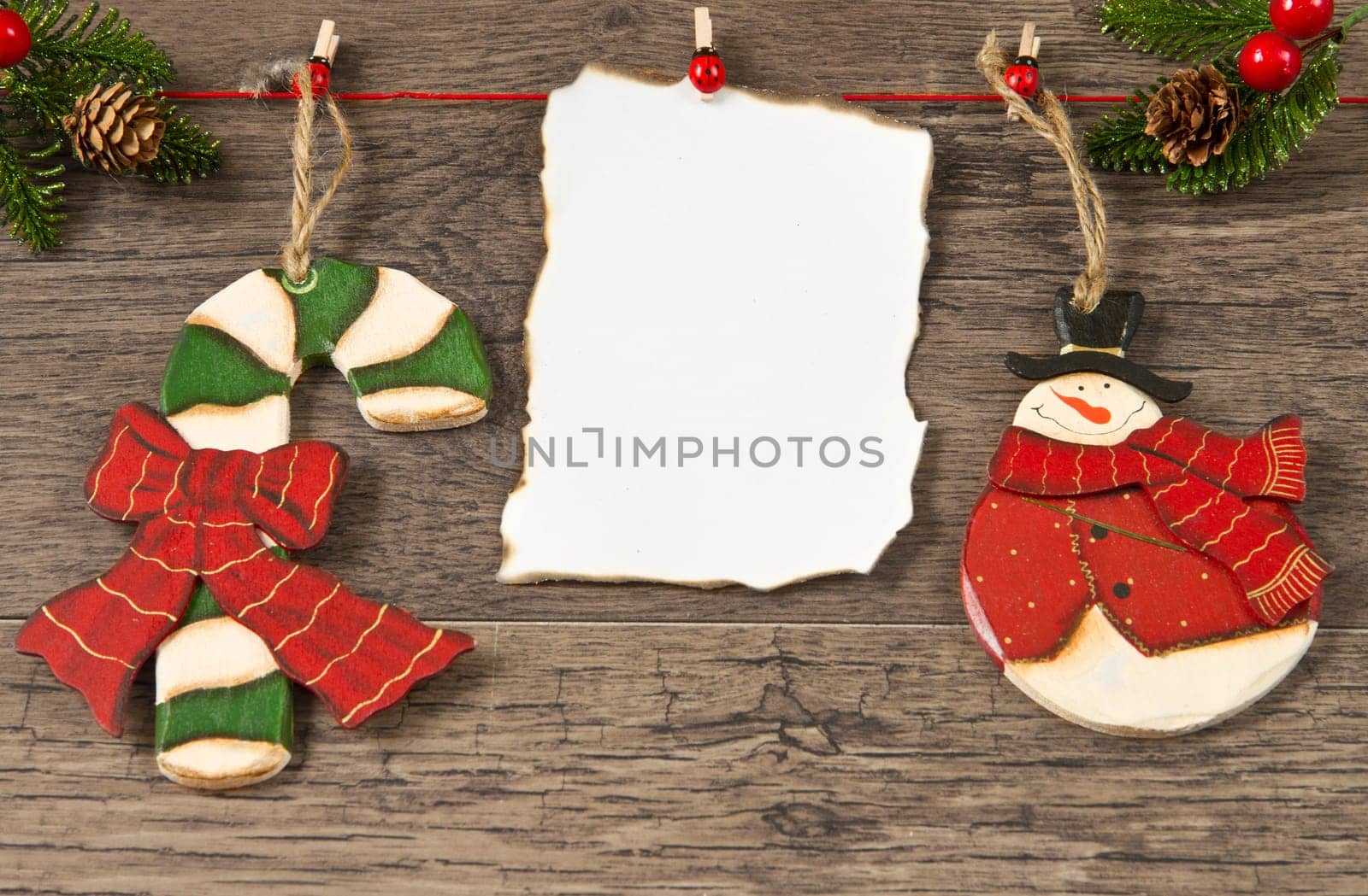 blank note with christmas decoration on wooden background