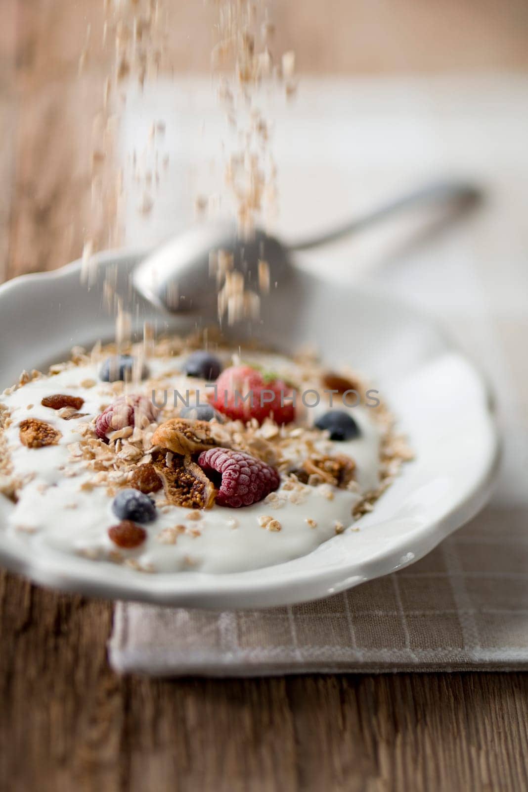 Fresh muesli with fruits for breakfast close up