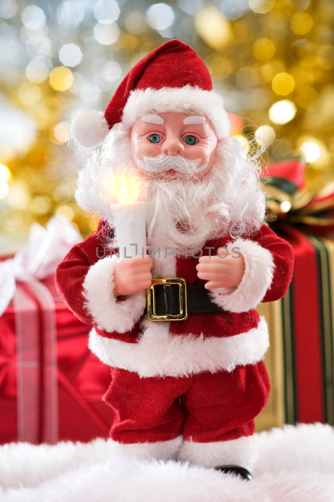 santa toy standing in front of presents
