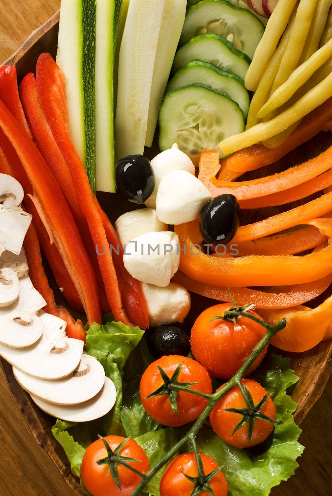 fresh sliced vegetables and mozzarella close up shoot
