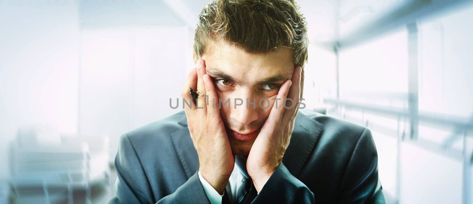 Creative image of attractive male touching his face in trouble