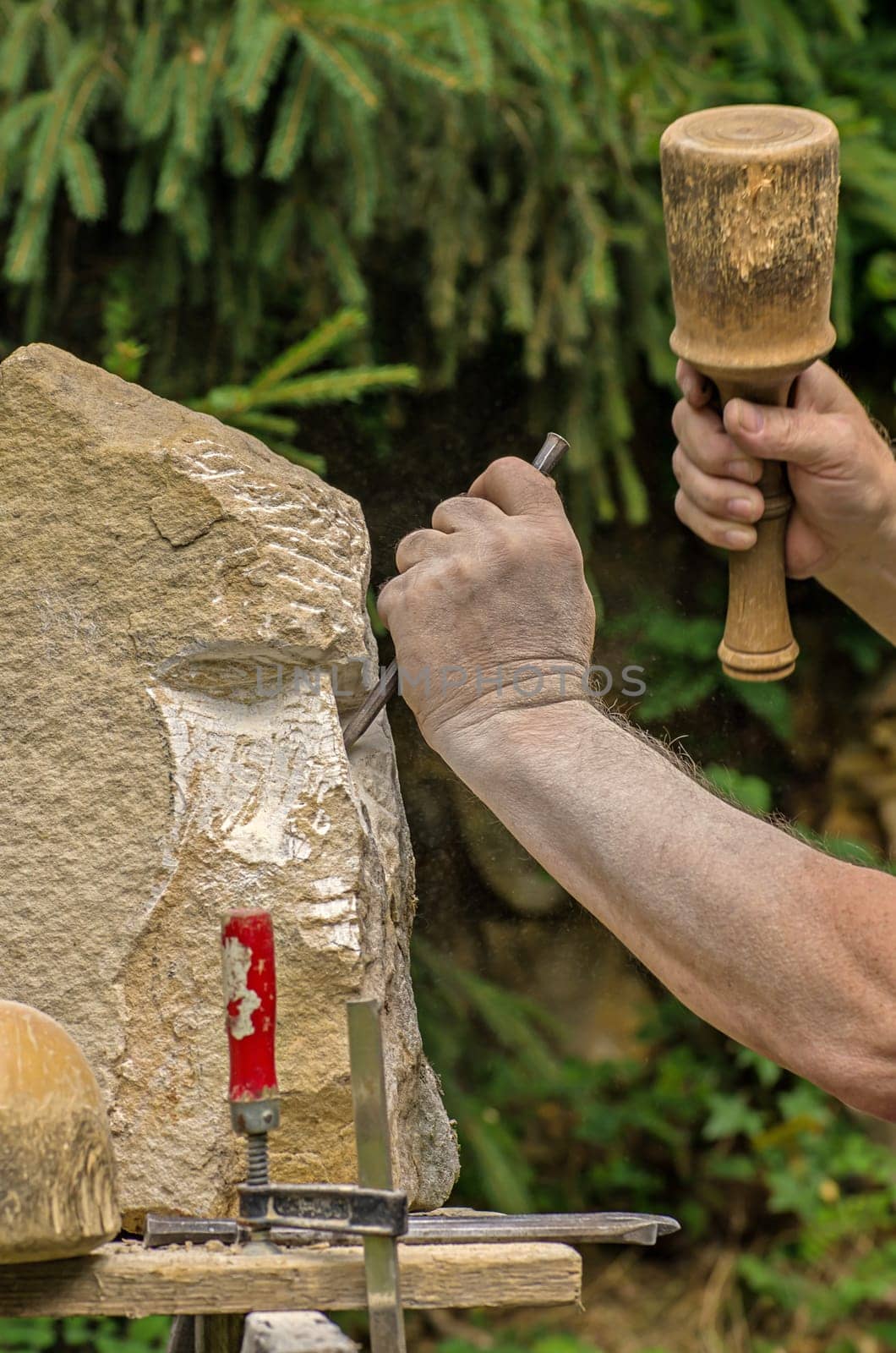 Sculptor working on a sculpture