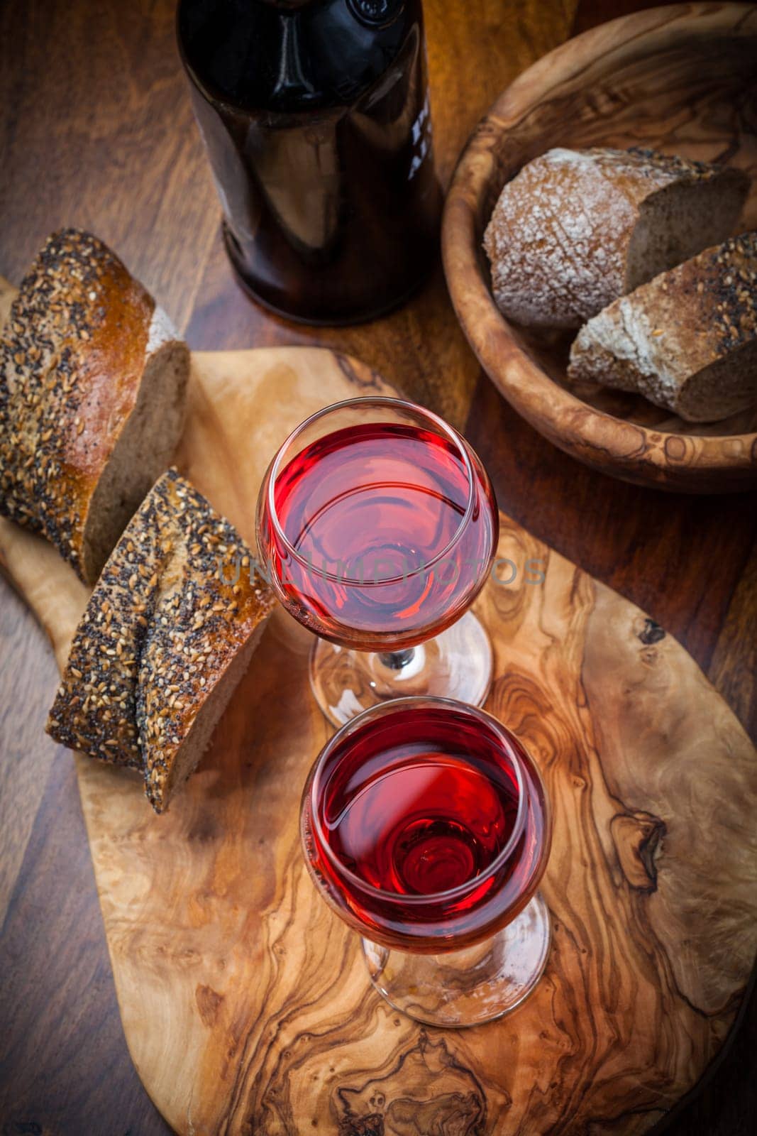 Two glasses of red wine with bread