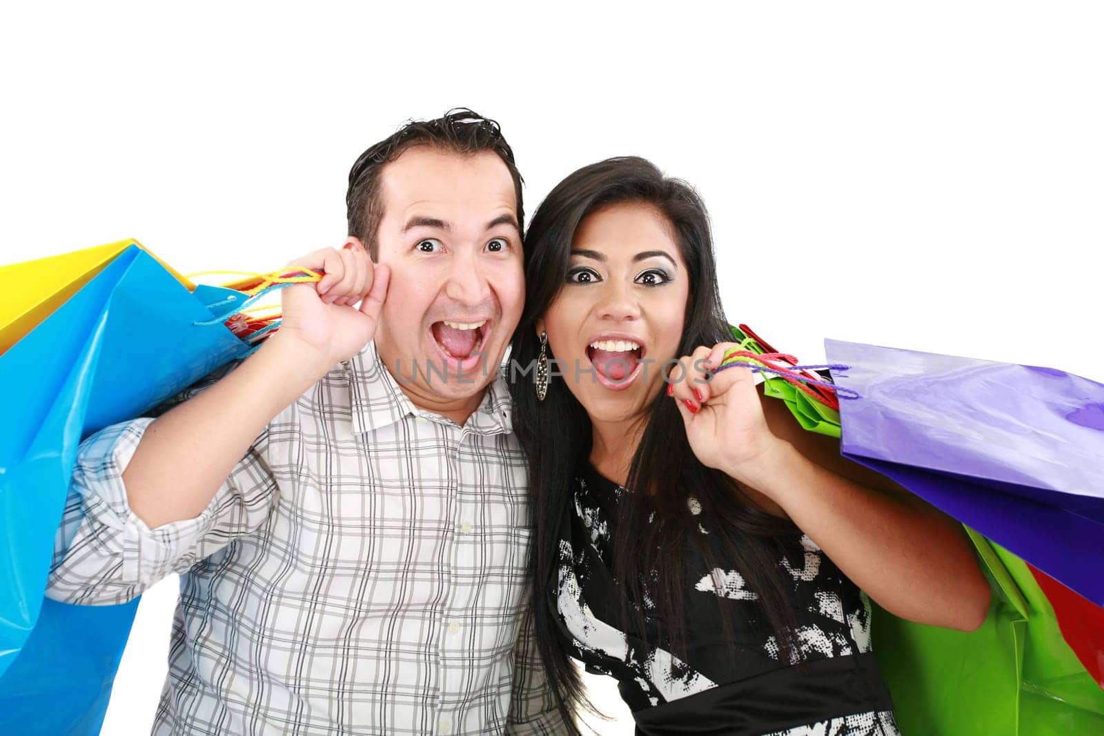 Beautiful young couple with shopping bags. Isolated on white