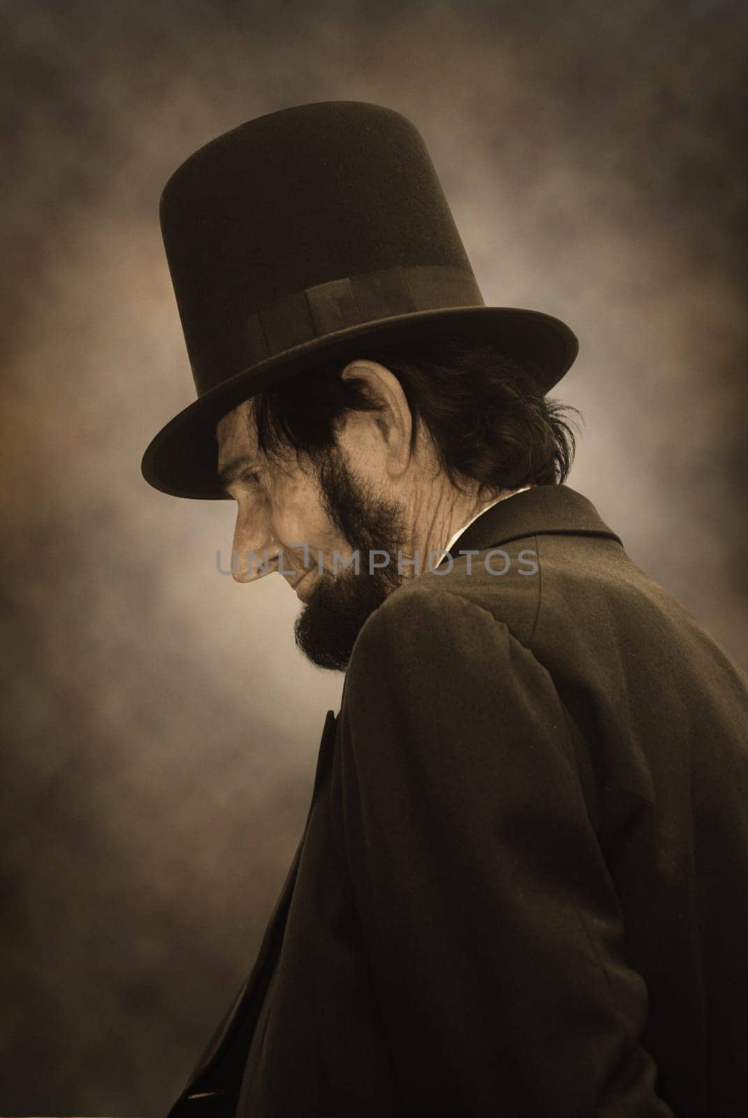 Sepia tone photo of Abraham Lincoln in profile