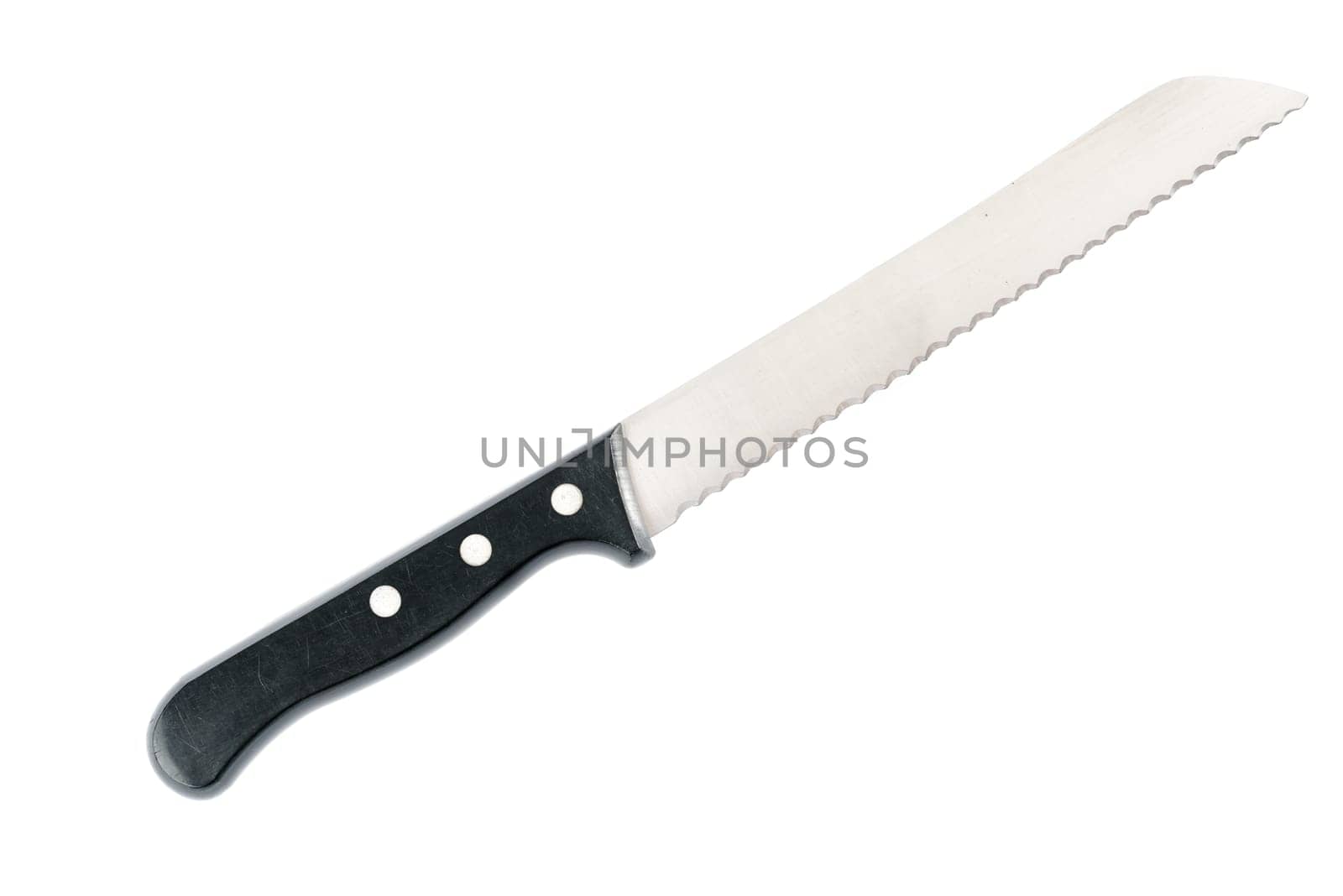 Bread knife against white background