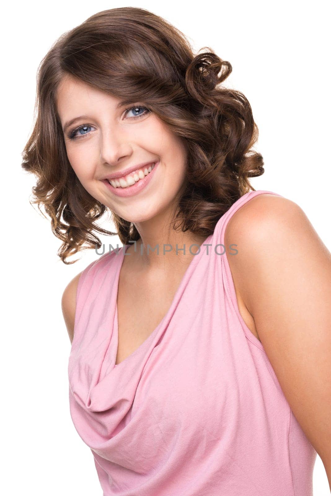 Young and smiling girl against white background