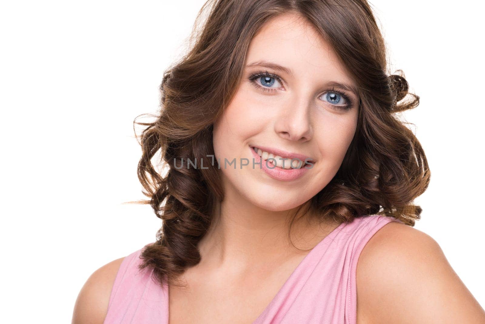 Young and smiling girl against white background