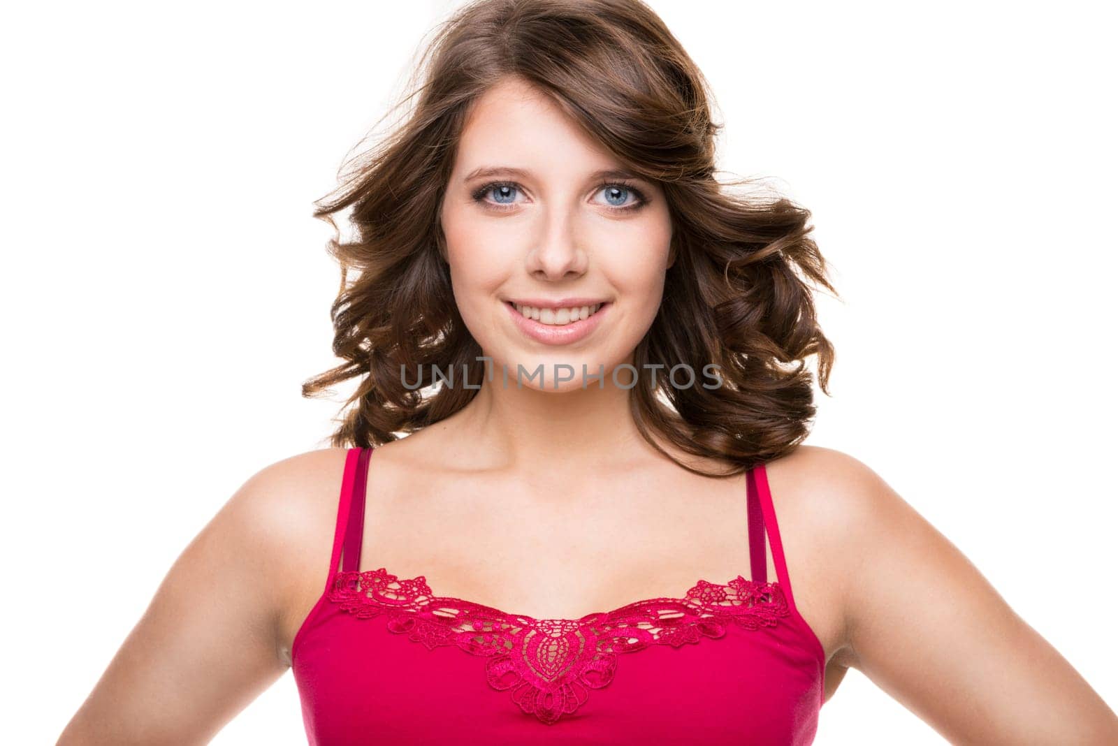 Young and smiling girl against white background