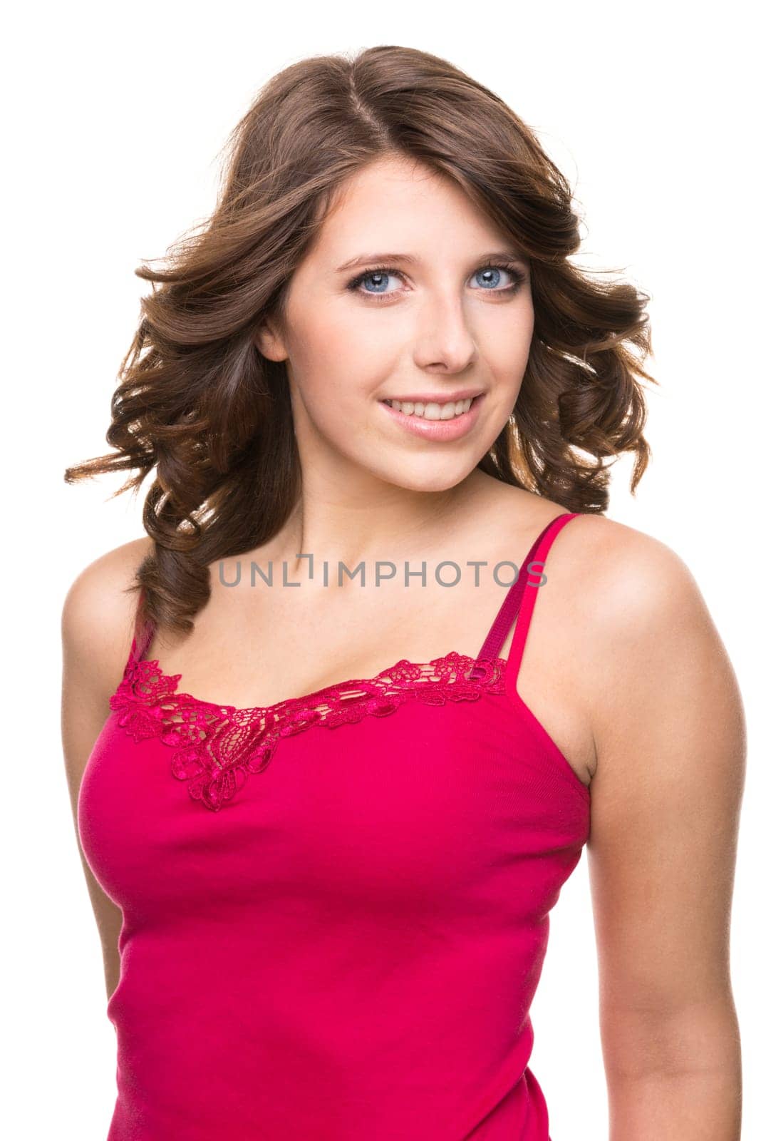 Young and smiling girl against white background