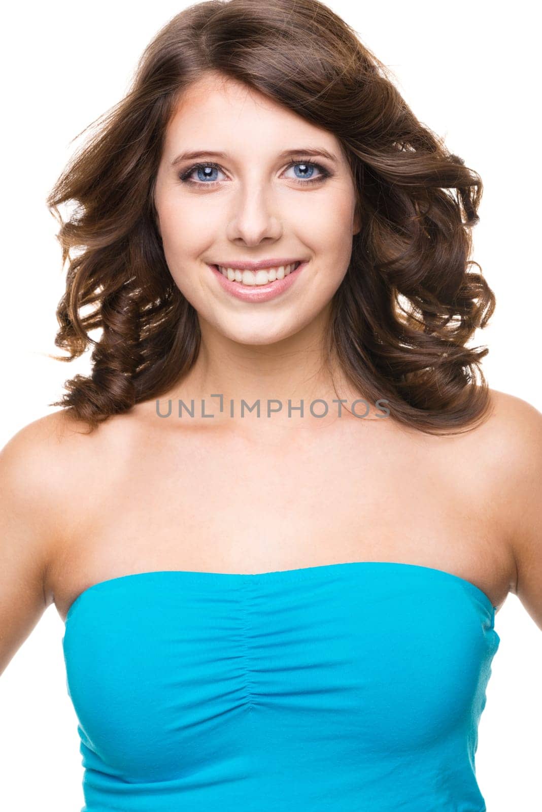 Young and smiling girl against white background