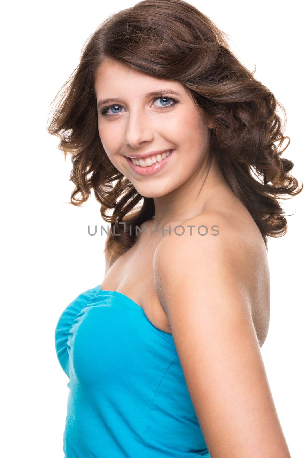 Young and smiling girl against white background