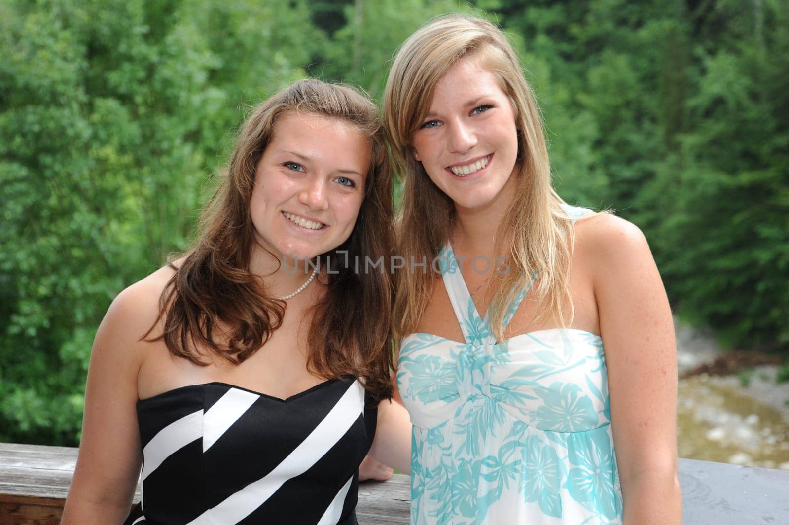Young laughing women in party outfit