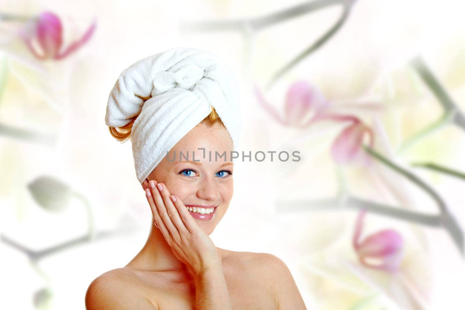 portrait of a pretty blonde with white towel on her head