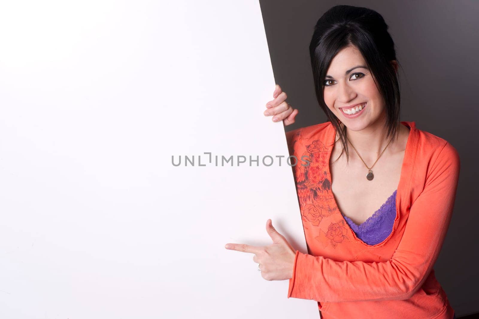 Pretty spokesperson points to a large piece of white board