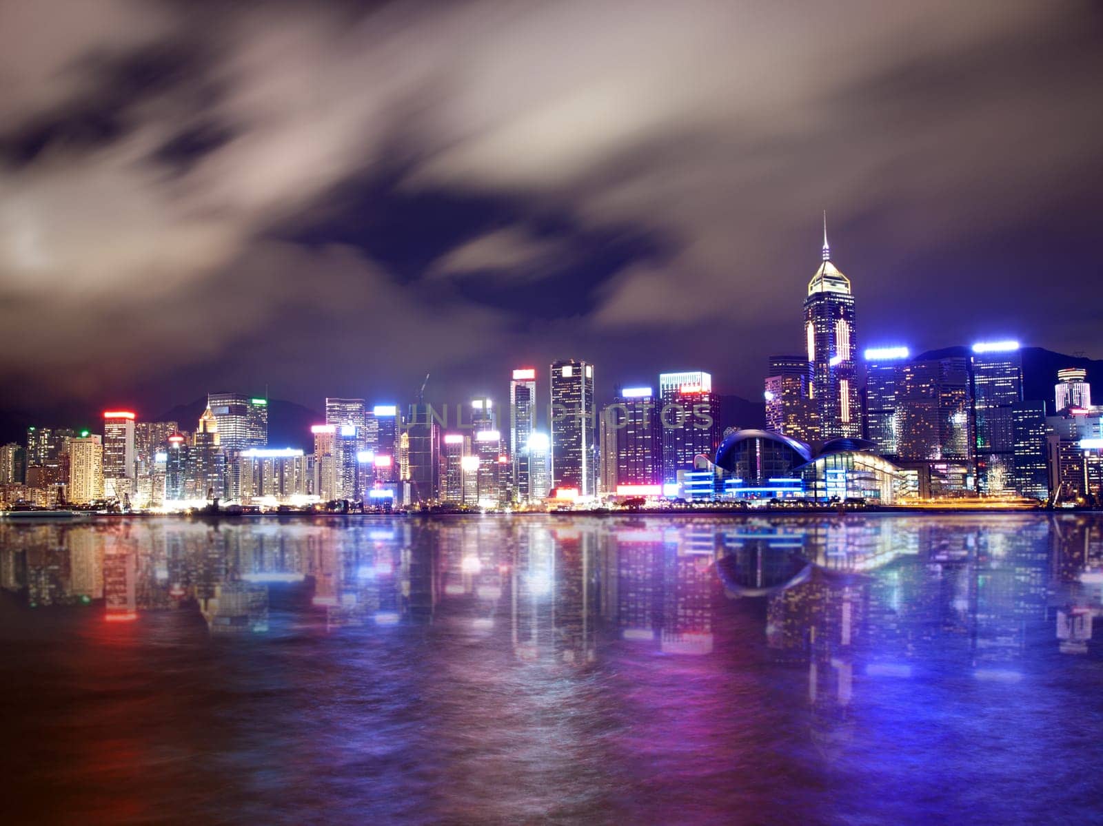 Hong Kong skyscrapers reflected on water at night