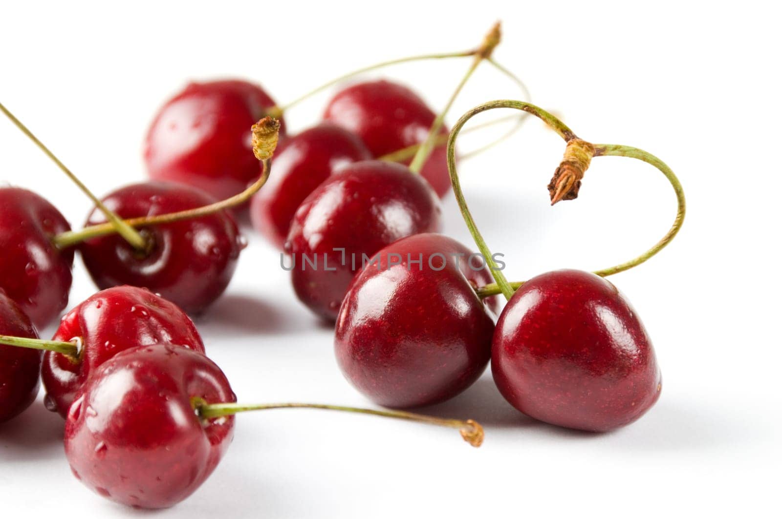 Shot of cherry berries with heart symbol