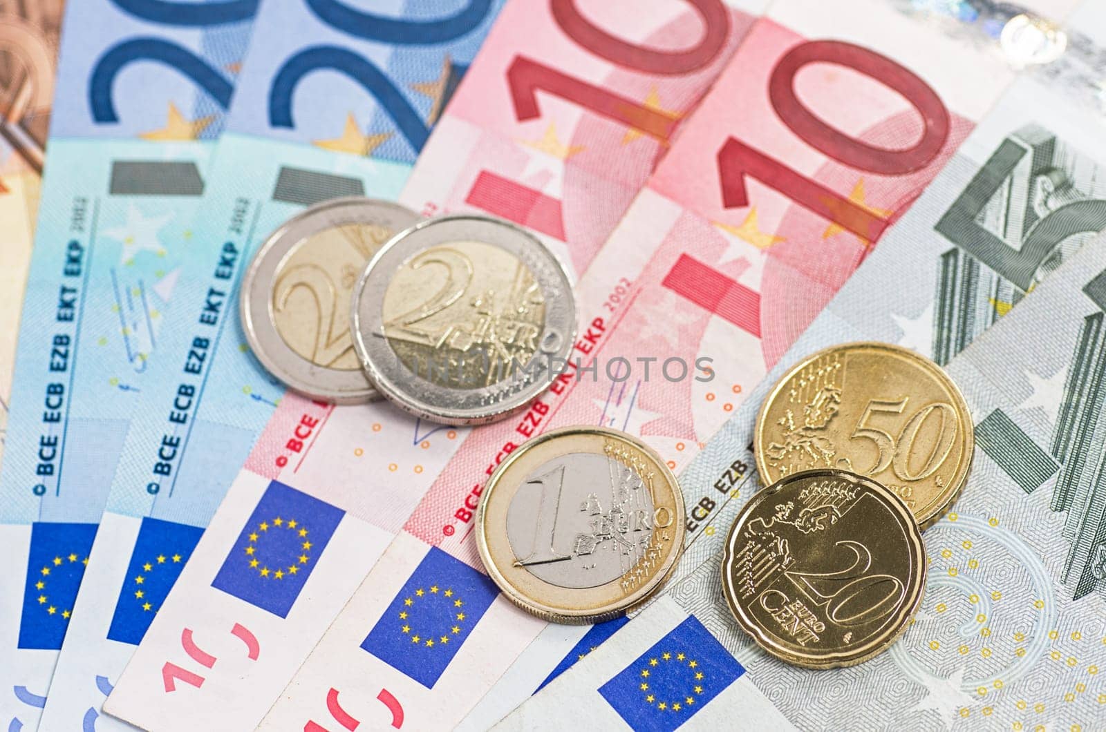 fanned banknotes with coins