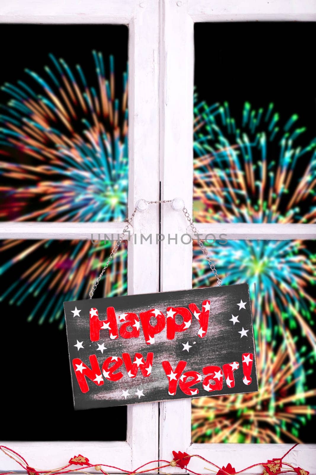 New Year's Eve fireworks with champagne glasses
