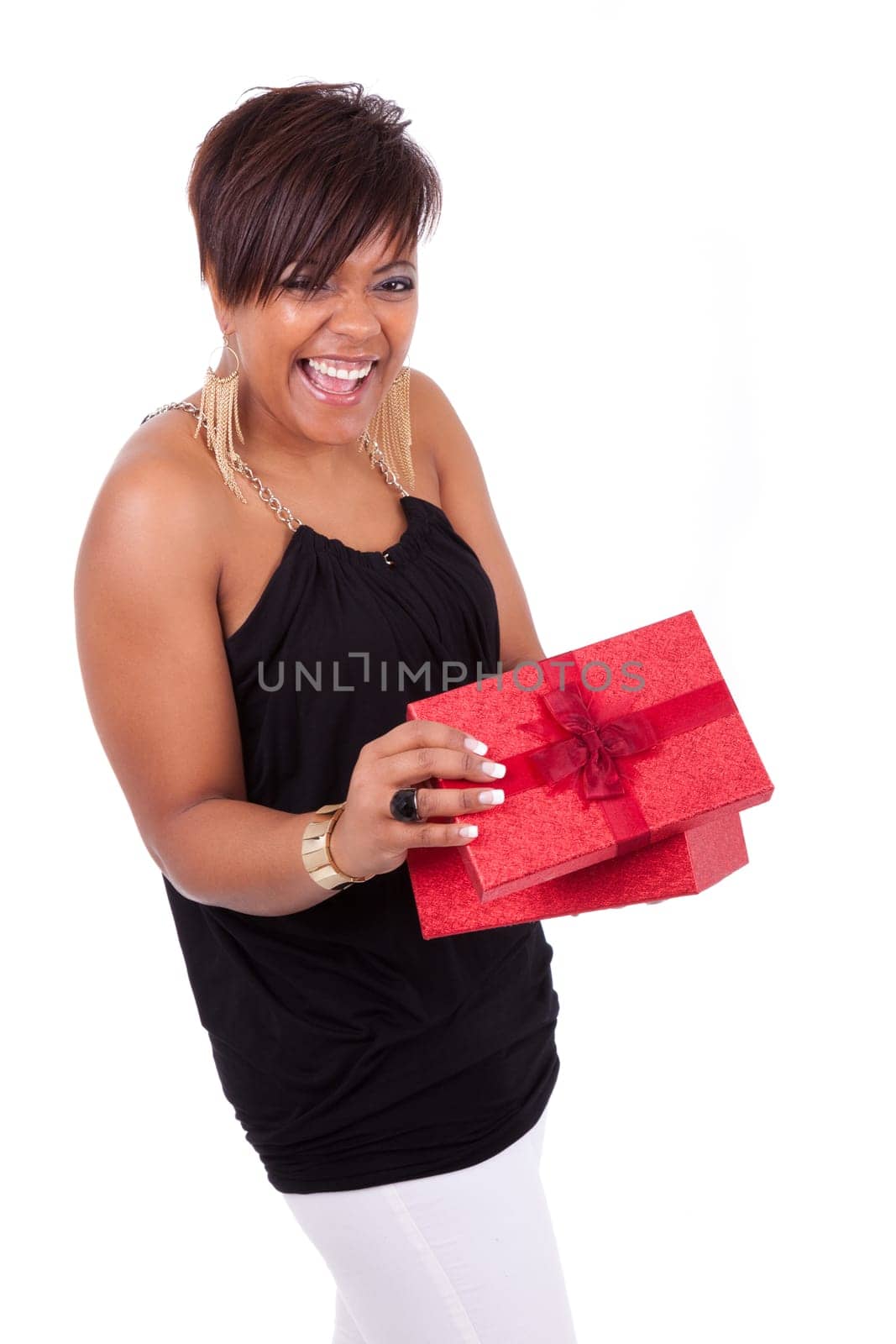 Portrait of a young African American woman opening a gift
