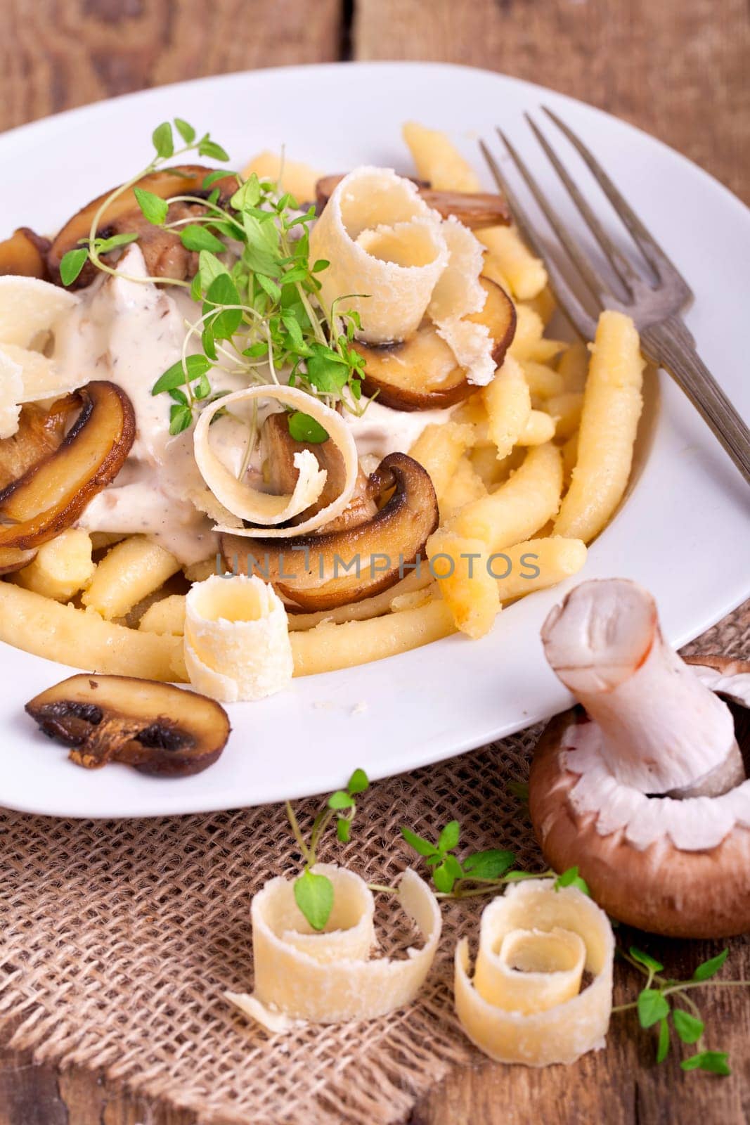 golden brown potato noodles with fresh champions